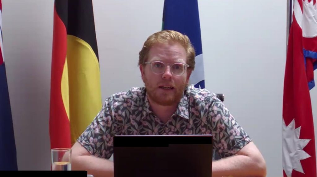 Image of Dylan Jones Virma addressing the alumni.