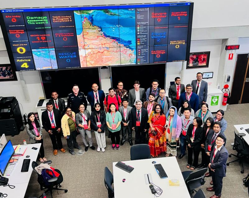 Melsan (front row, right) with participants of the Australia Awards Short Course during a study visit to the State Disaster Coordination Centre at Kedron, Brisbane, focusing on decision-support tools for disaster planning and response