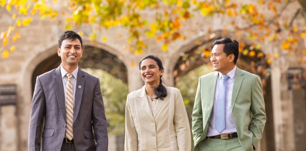 Three Nepalese Australia Awards alumni walk together outdoors